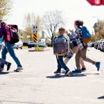 Photograph of kids crossing a road