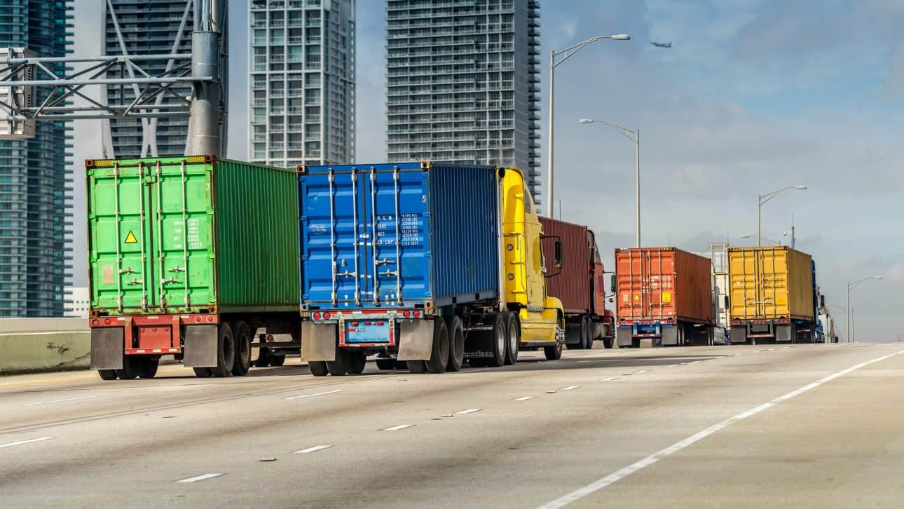 Trucks leaving the cargo area of the Port of Miami ready to deliver