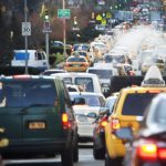 Busy vehicles driving around in NYC