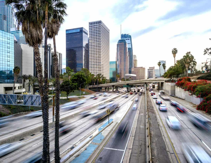 Busy California highway with palm tree